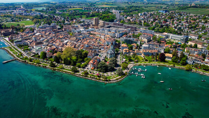 A panoramic aerial view around the old town of the city Morges in Switzerland on a sunny spring noon