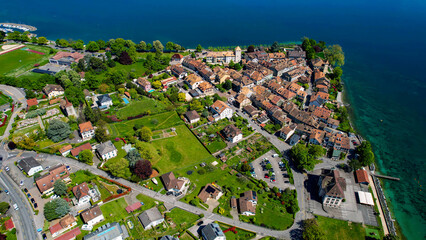 A panoramic aerial view around the old town of the city Saint-Prex in Switzerland on a sunny spring...