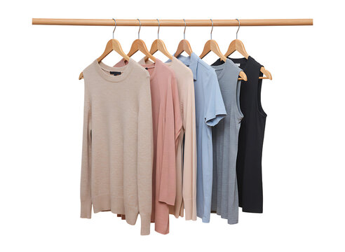 Collection of casual clothing items hanging on wooden hangers isolated on transparent background