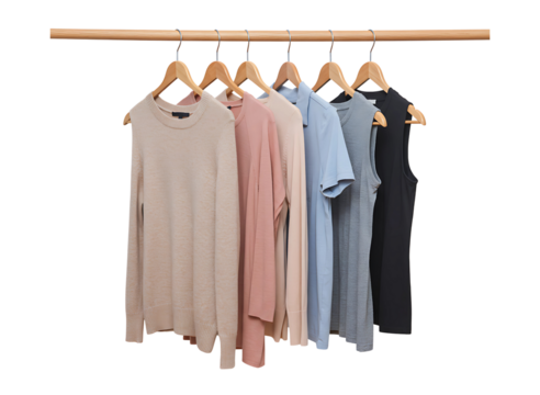 Collection of casual clothing items hanging on wooden hangers isolated on transparent background