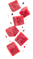 Raw Beef Cubes And Seasoning Spices Falling Against A Transparent Background Showcasing Red Meat Texture And Culinary Ingredients