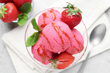 Tasty sorbet with strawberries and mint served on light table, flat lay