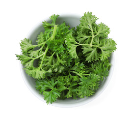 Fresh parsley in bowl isolated on white, top view