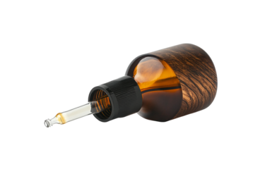 Beard oil in an amber bottle with a precision dropper designed for moisturizing and grooming facial hair isolated on transparent background PNG