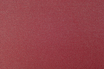 Fototapeta premium Texture of colored paper. Decorative sheet of cardboard. Red shiny background