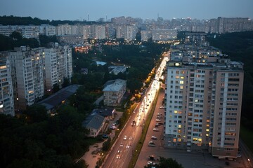 Naklejka premium Urban Landscape at Dusk with City Lights and High-Rise Buildings