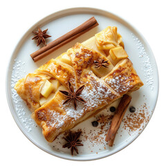 Delicious apple strudel served on a white plate, garnished with cinnamon sticks, star anise, powdered sugar, and a sprinkle of cocoa isolated on transparent background 