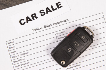 Car key, inscription car sale and vehicle sales agreement. Sales, purchases of automobile....
