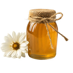 Glass jar filled with golden honey and tied with twine next to a white flower and peppercorns