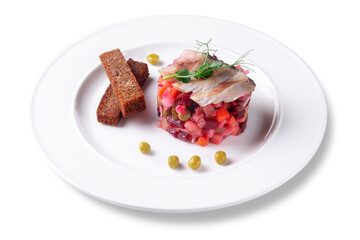 Traditional Russian vinaigrette salad with diced vegetables, green peas and herring fillet, served with crispy rye bread sticks. Isolated on white background, top view.