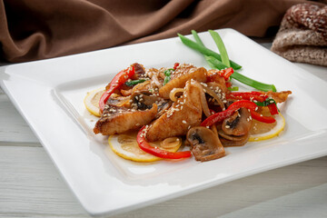 Crispy fish fillet served with sautéed bell pepper, mushrooms, onion and sesame seeds. Garnished...