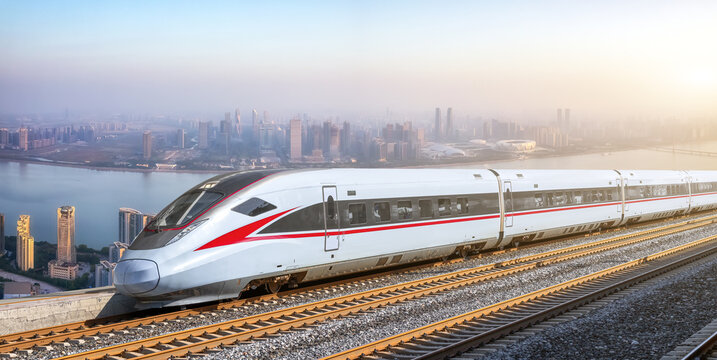 High-speed train travels across modern city landscape