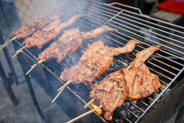 Grilled Chicken on Skewers over Hot Charcoal, Smoking Barbecue Preparation