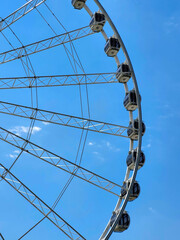Giant Ferris wheel against a clear blue sky