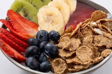 Healthy breakfast bowl - berries, muesli, fruits. Healthy detox morning meal. Whole grain flakes...