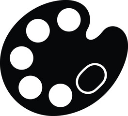 Fototapeta premium A black artist palette featuring five white circles and an empty space is seen here