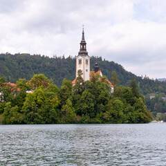 A serene view of the iconic Pilgrimage Church of the Assumption of Mary situated on Bled Island,...