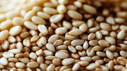 A close-up photo of sesame seeds, ideal for food or agriculture related uses