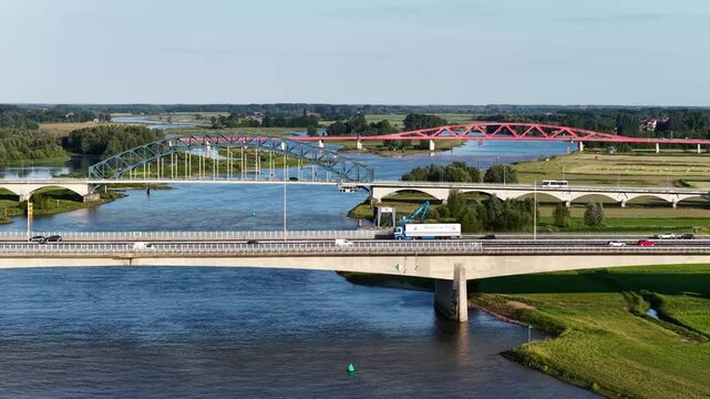 Zwolle, 12th of July 2025 Freighter on the IJssel River with the A28 near Zwolle with the IJssel Bridge, Katerveer II Bridge, and the Hanzeboog Bridge