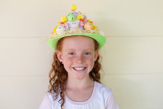 Young girl wearing an Easter hat