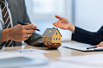 Real estate agent meeting customer with insurance policy about house contract