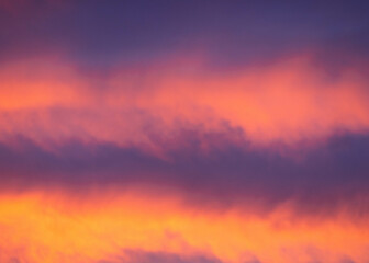 Serene sunset sky with warm pink clouds 