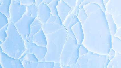 Obraz premium Winter texture: Blue and white abstract patterns of snow and ice on a frozen river surface
