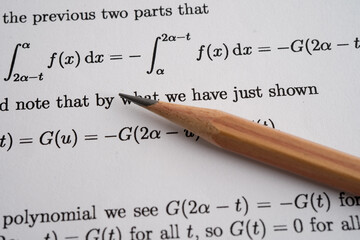 Pencil on mathematic formula exercise test paper in education school.