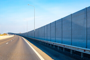 Anti-Noise screen along the road going up. Noise protection fence preventing noise pollution
