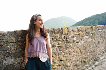 Portrait of happy woman with ostomy bag outside. World Cancer Day