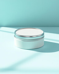 Small white round tin container with sleek silver lid, minimalist product mockup on smooth pale blue background