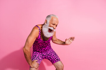 Photo of hilarious positive man wear trendy overall laugh empty space isolated on pink color...