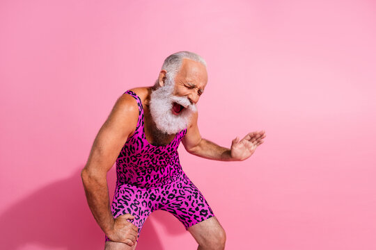 Photo of hilarious positive man wear trendy overall laugh empty space isolated on pink color background - Powered by Adobe