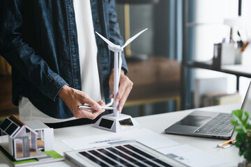 Green energy experts collaborating on net zero action plan in modern workplace for climate solutions