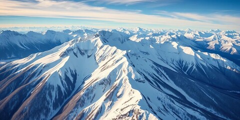 Fototapeta premium Majestic snow-capped peaks, pristine winter landscape from above, summit, wilderness