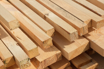 Stack of wooden boards close-up for construction projects