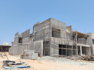 Under Construction House Or Villa's With Concreate Block Or Bricks.
Exterior View 02 Story luxurious Modern Design House architecture.
InComplete residential Villa Structure with Erected Scaffolding.