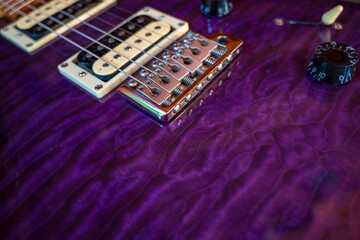 closeup of a special edition 24 custom Roasted Maple Purple Quilt PRS electric guitar