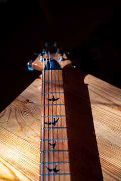fretboard neck and head of a custom prs electric guitar with bird markers decoration