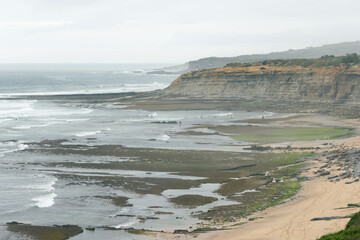 rolling ocean waves on the coastal shores of portugal