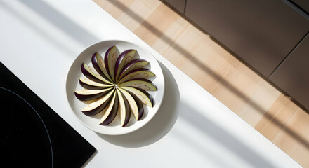 Sliced Eggplant Elegance On White Plate In Kitchen Under Sunlight
