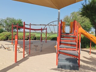 Kids Playing Area.
Colorful kids playground beautiful garden children amenity area in community society. 
Children Swings, Kids sliding, Playing Yard
Adult play activities in public Safe Sport Park.
