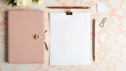 Elegant flat lay of a pink planner blank paper rose gold pen and white flowers on a marble background