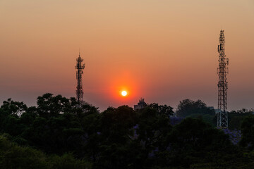 sunset view with telecommunication antenna on the road in Zambia