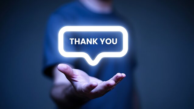 Photo of hand holding a glowing thank you message