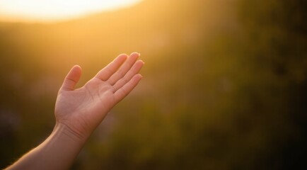 Female hand reaching out toward bright sunshine, light background