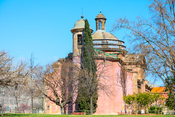 Church in Ciutadella Park in Barcelona. Historic church with pink facade and ornate dome stands...