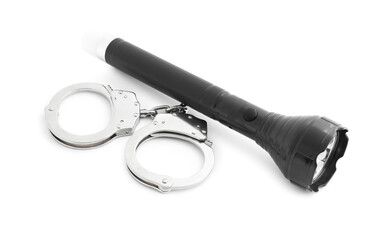 Flashlight and handcuffs on white background. Police equipment