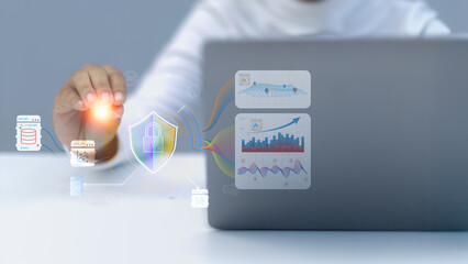 A person interacts with a virtual data security interface showing charts and protected databases.