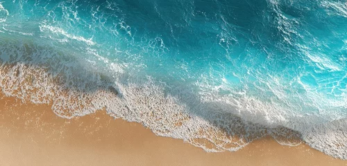 Selbstklebende Fototapeten High-angle view of a beach with turquoise water and foamy waves © Rahul